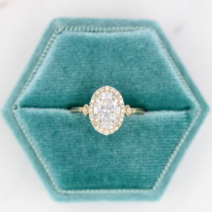 Casey Ring (Oval) in Yellow Gold with 2ct Moissanite in a blue velvet ring box