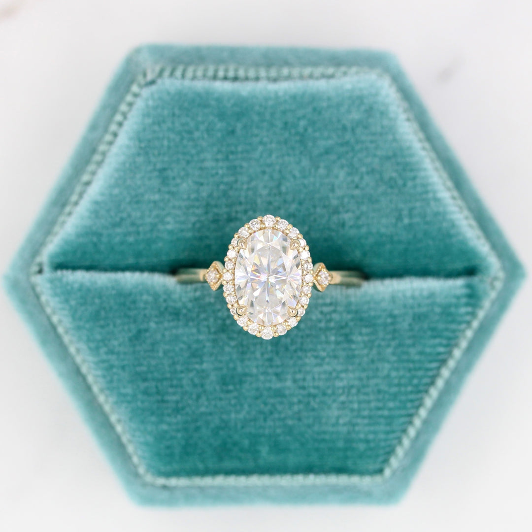 Casey Ring (Oval) in Yellow Gold with 2ct Moissanite in a blue velvet ring box
