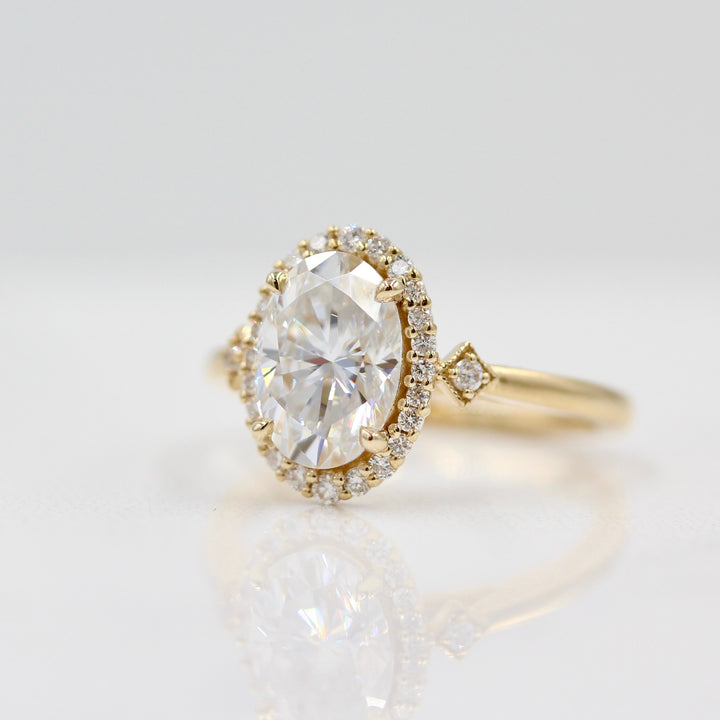 Casey Ring (Oval) in Yellow Gold with 2ct Moissanite on white background