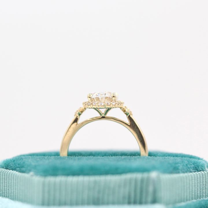 Casey Ring (Oval) in Yellow Gold with 2ct Moissanite in a blue velvet ring box
