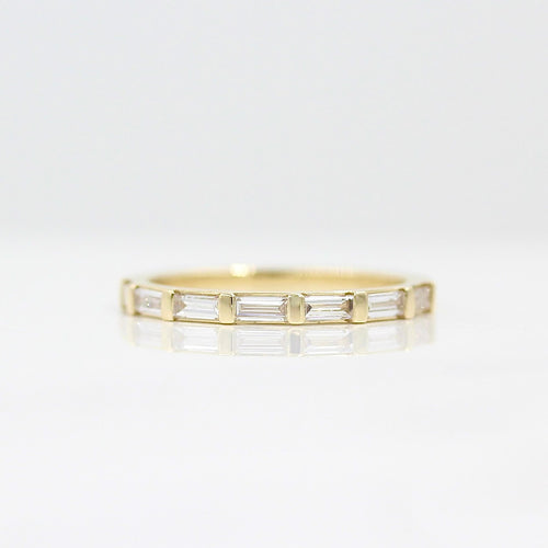 Close-up front view of the Horizon baguette diamond wedding band