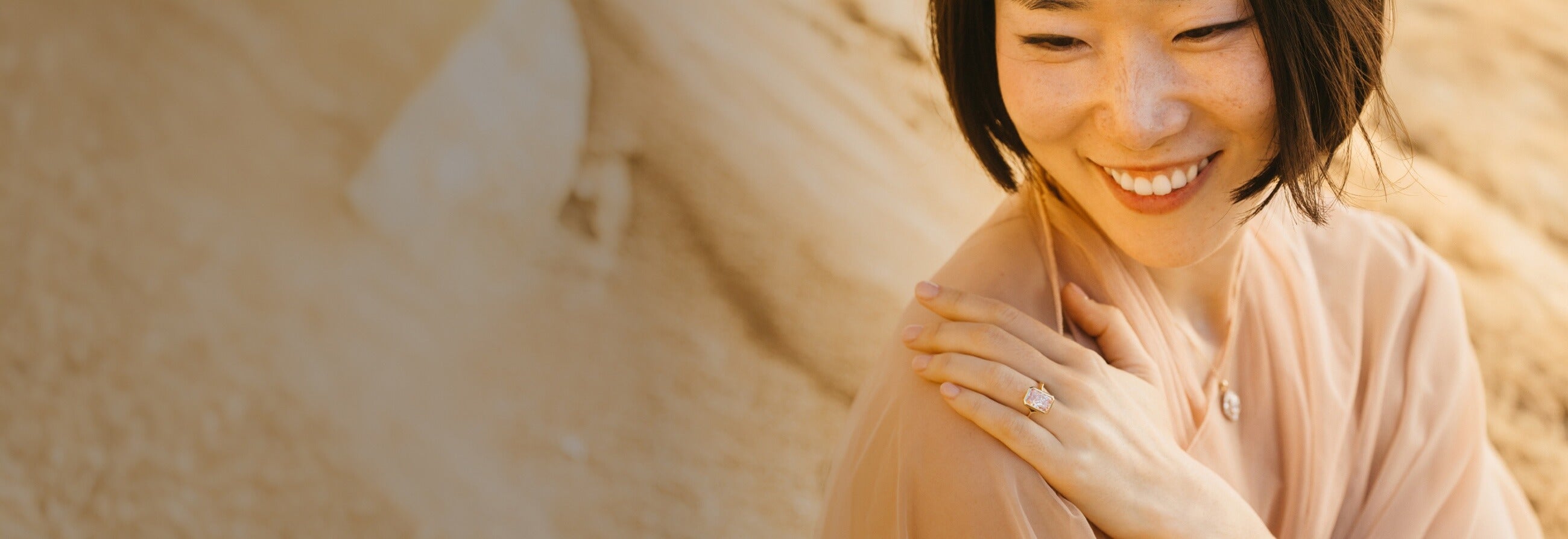 Girl hand on shoulder wearing Diamond Ring