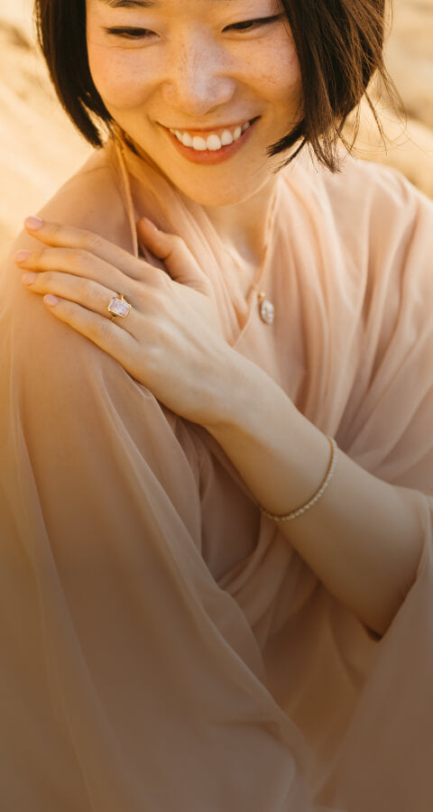 Girl hand on shoulder wearing Diamond Ring