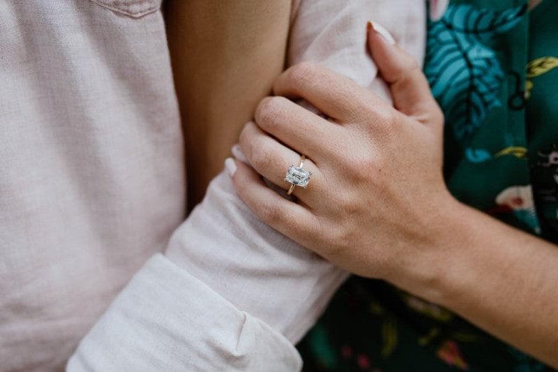 3ct cushion solitaire modeled on hand