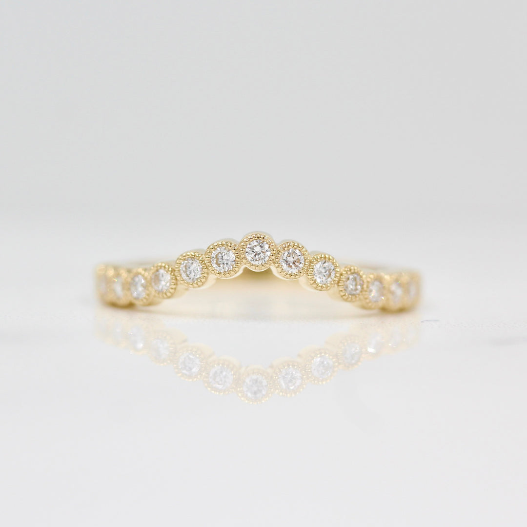 yellow gold contour band on white background