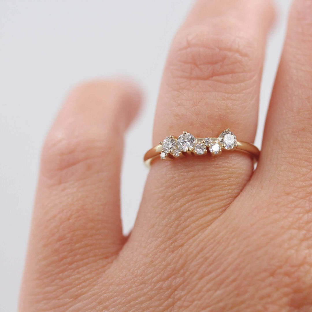 hand wearing a cluster diamond ring