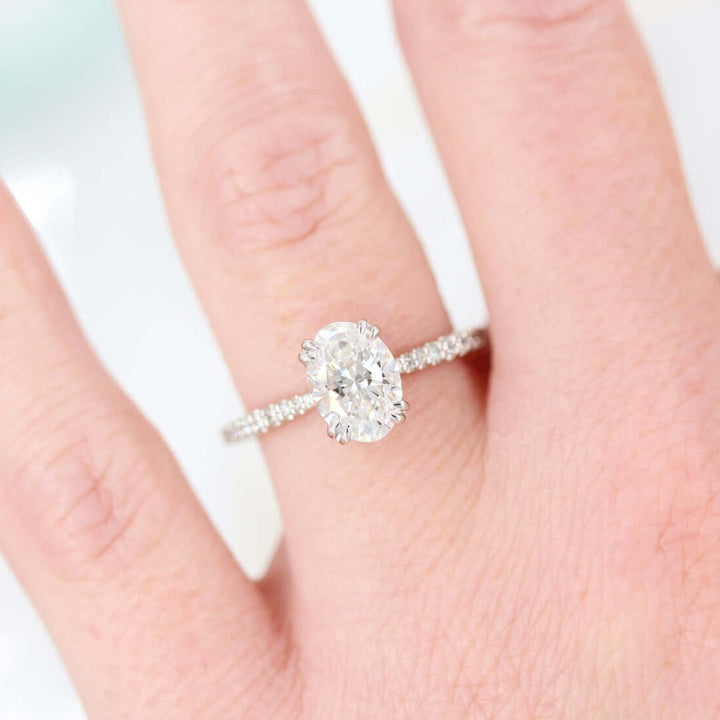 hand wearing grace 2ct oval moissanite engagement ring