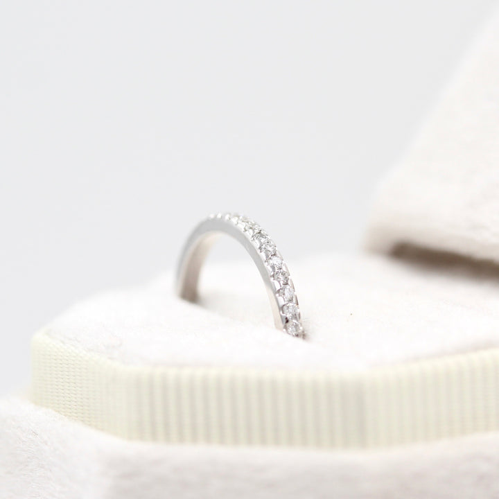 Top View of Pave Diamond Band in Off-White Ring Box