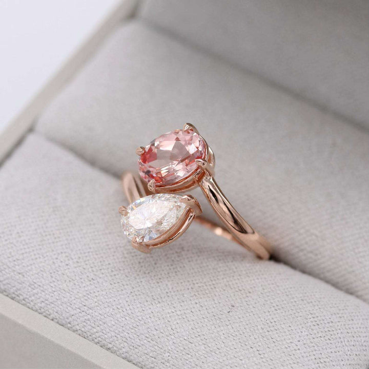 peachy-pink sapphire and diamond ring in ring box