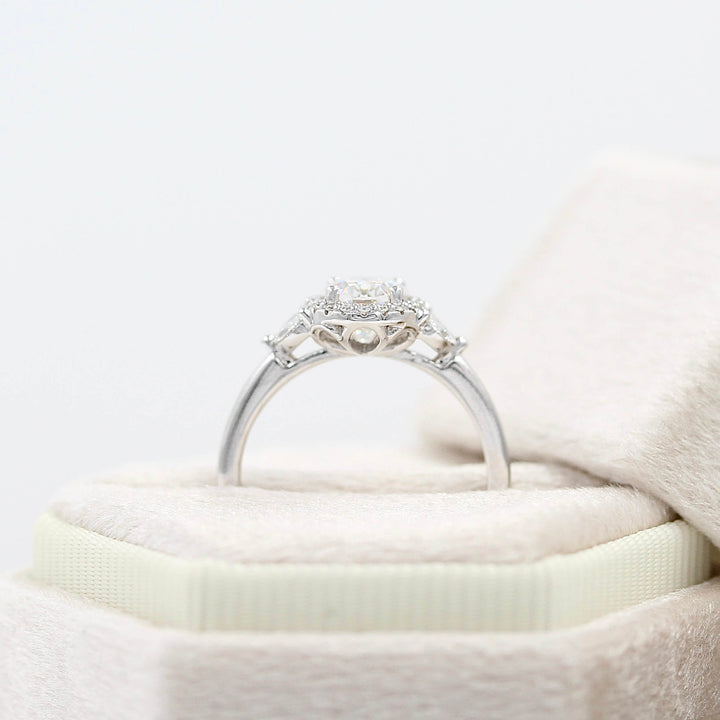 a platinum engagement ring in a box.