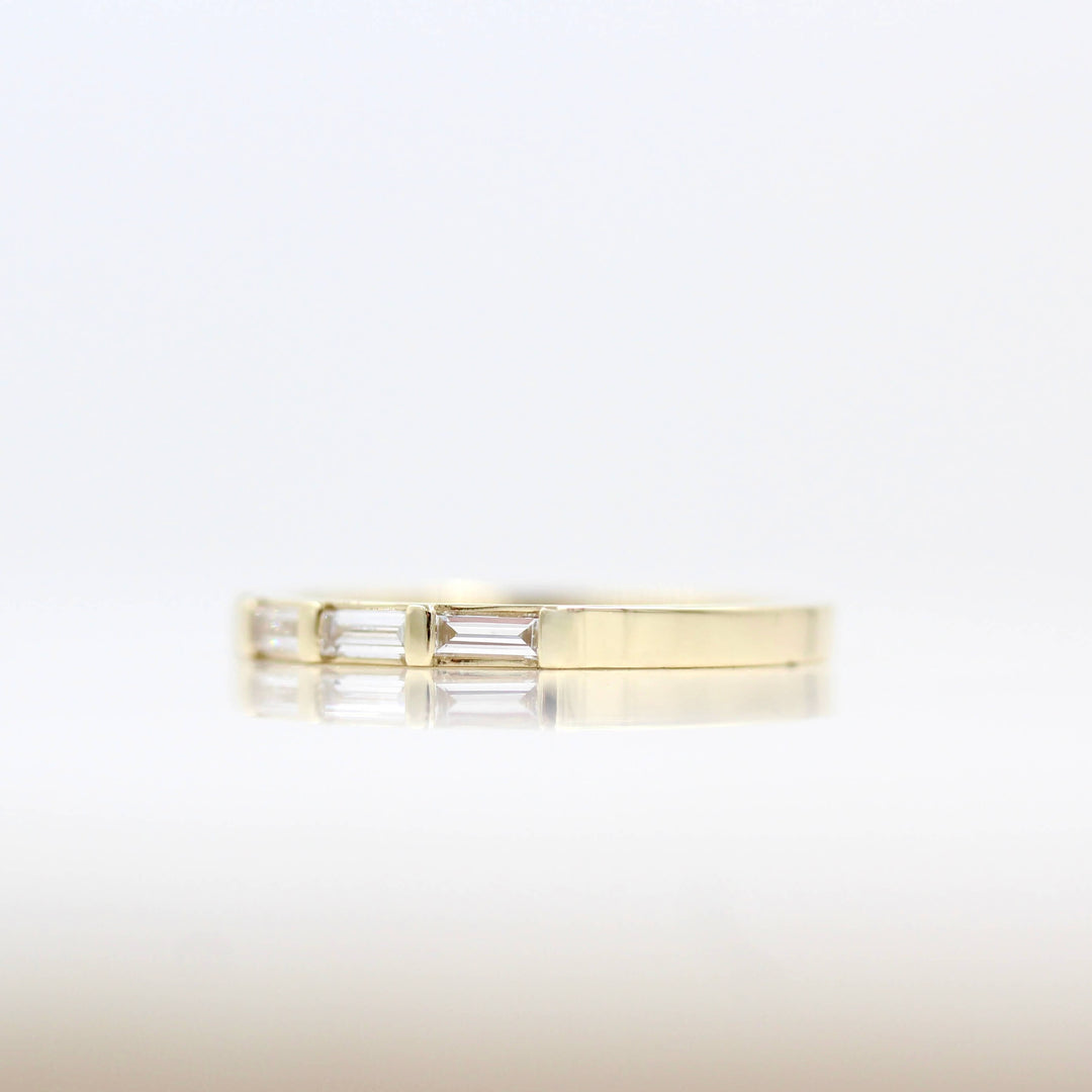 Right side view of the Horizon thin baguette wedding band