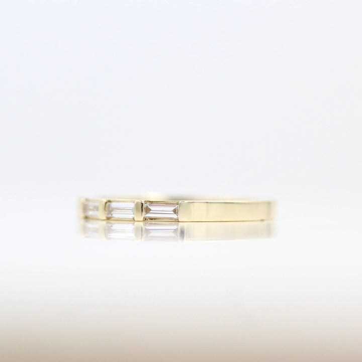 Right side view of the Horizon thin baguette wedding band