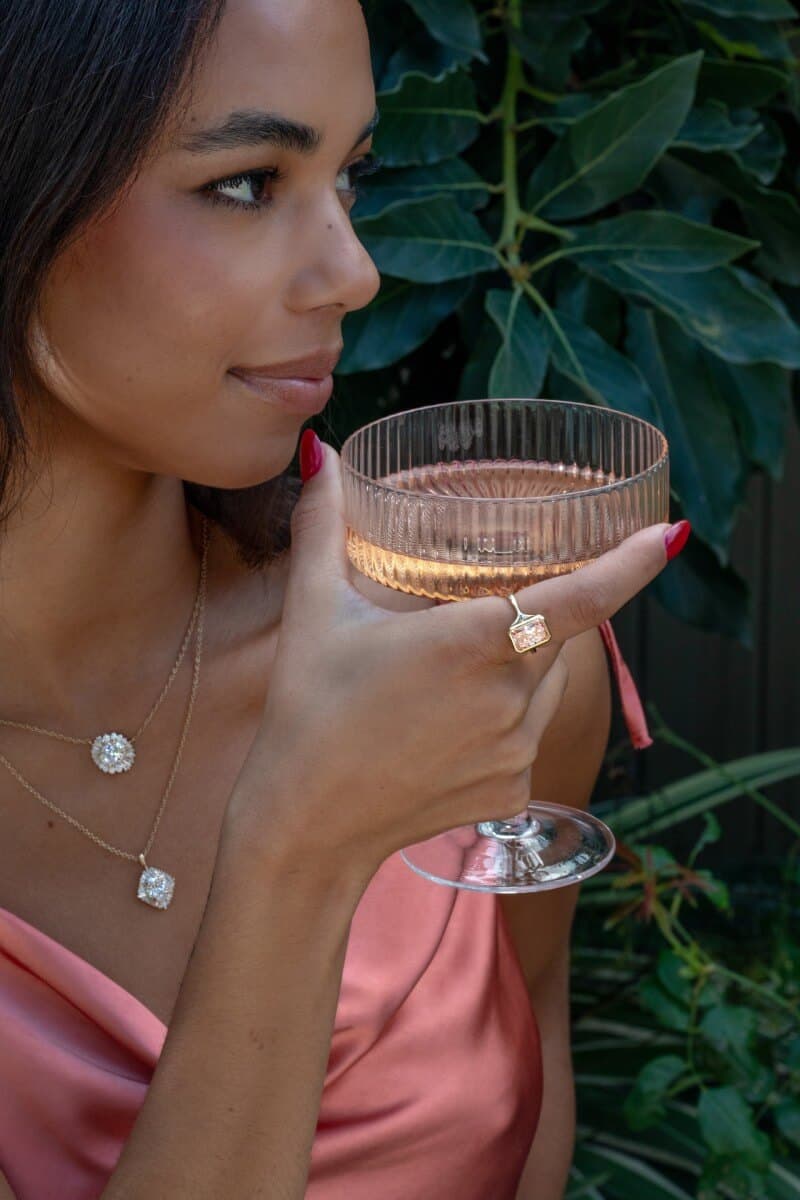 model wearing two lab-grown diamond necklaces