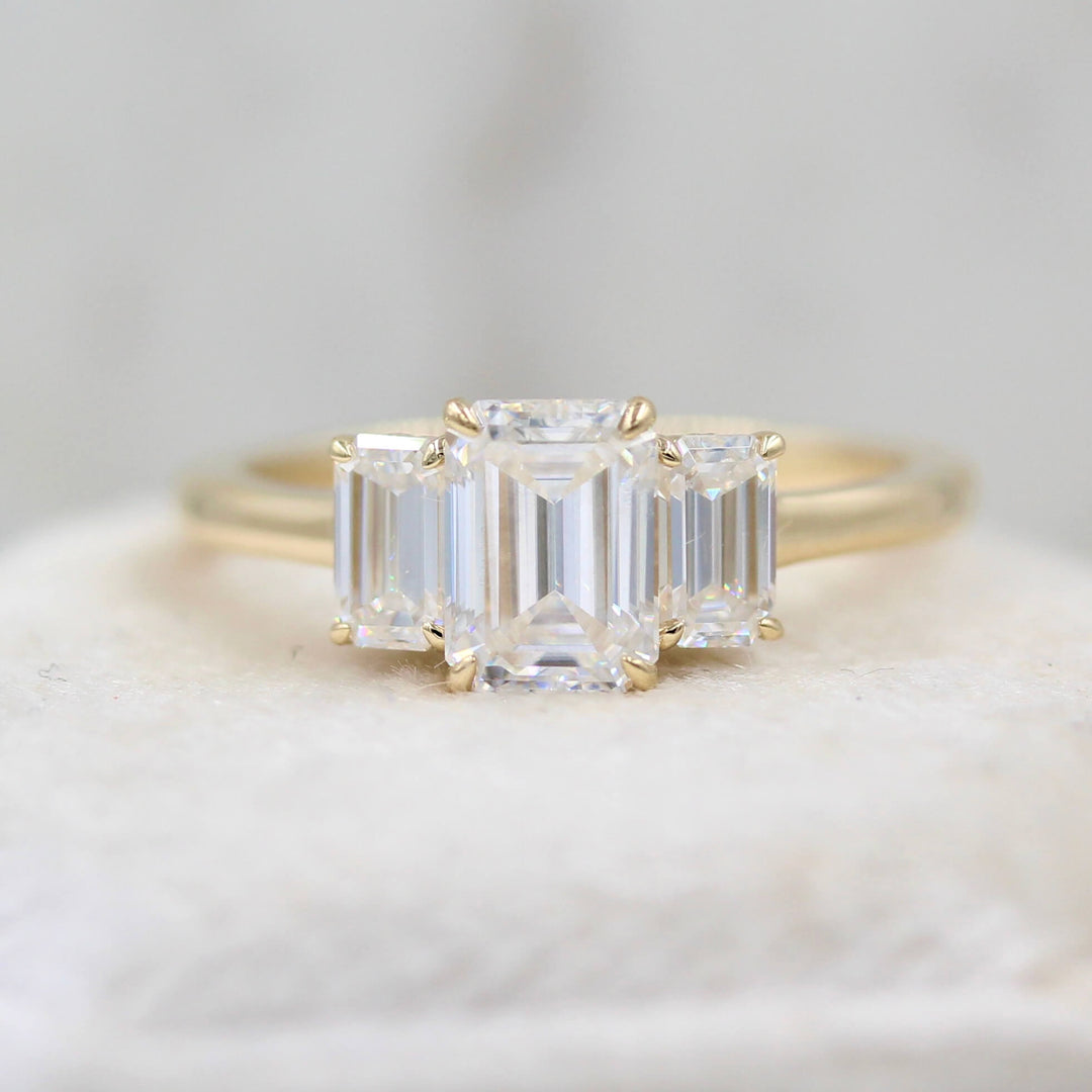 Three-stone emerald-cut engagement ring