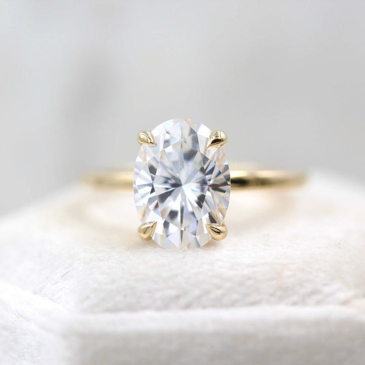 Oval solitaire engagement ring with thin band