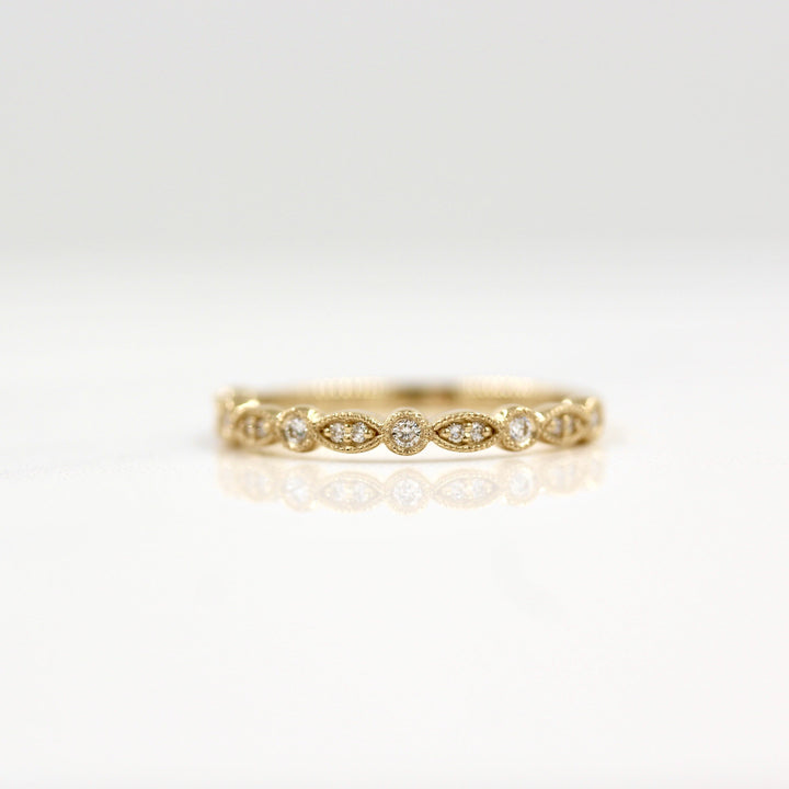 Yellow gold vintage-style wedding band with lab-grown diamonds and milgrain details