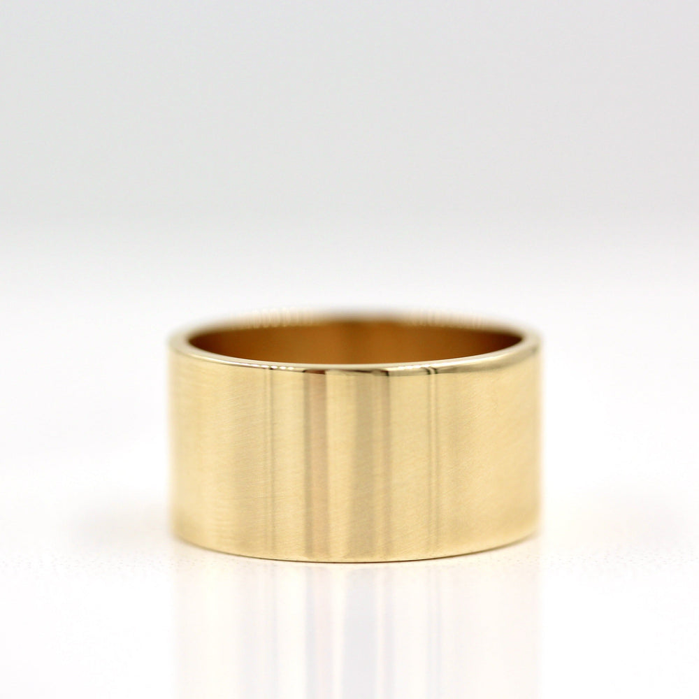 10mm men’s cigar band ring on white table