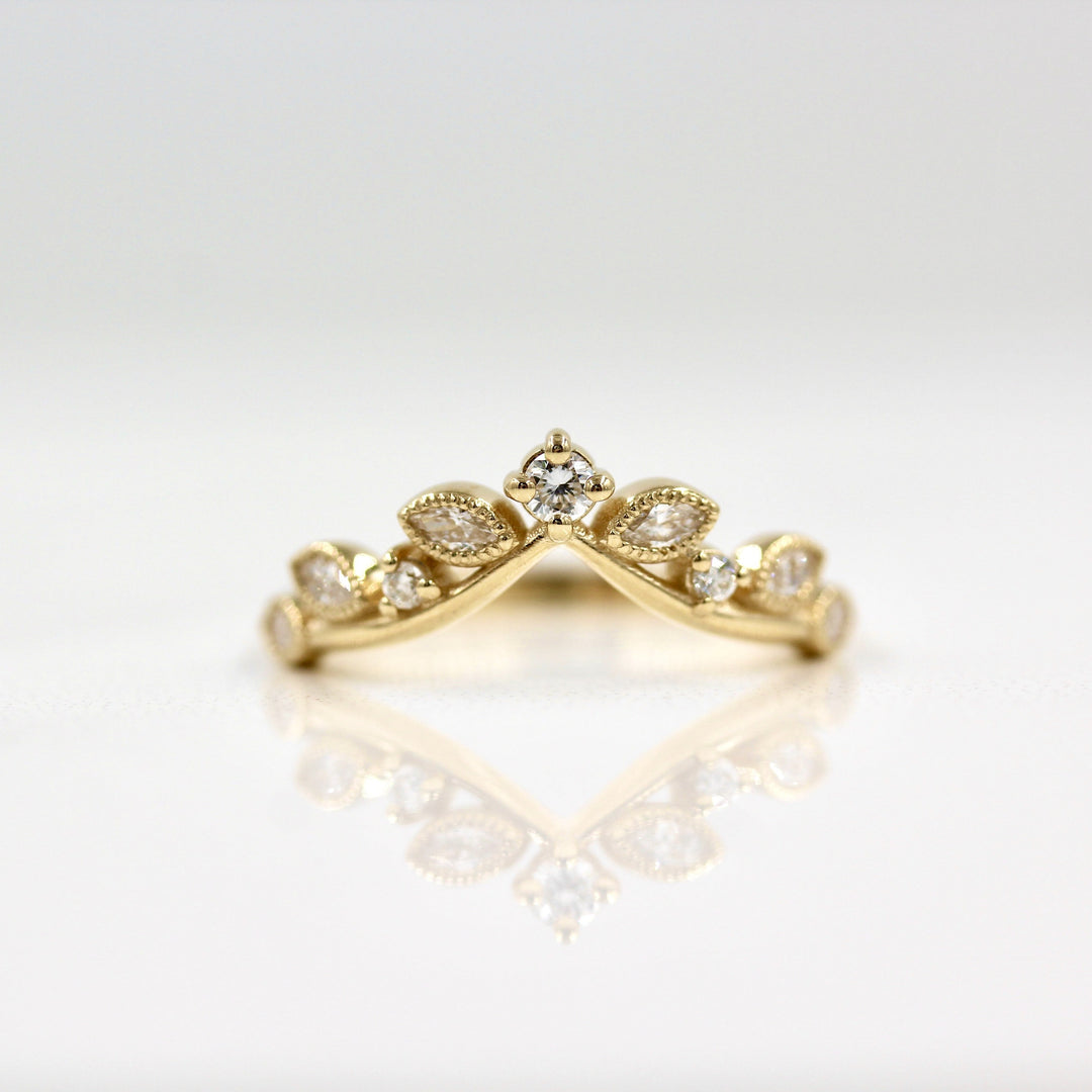 Lab-grown diamond ring with marquise and round diamonds in yellow gold
