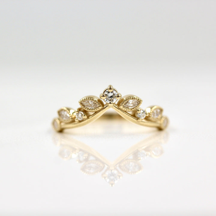 Lab-grown diamond ring with marquise and round diamonds in yellow gold