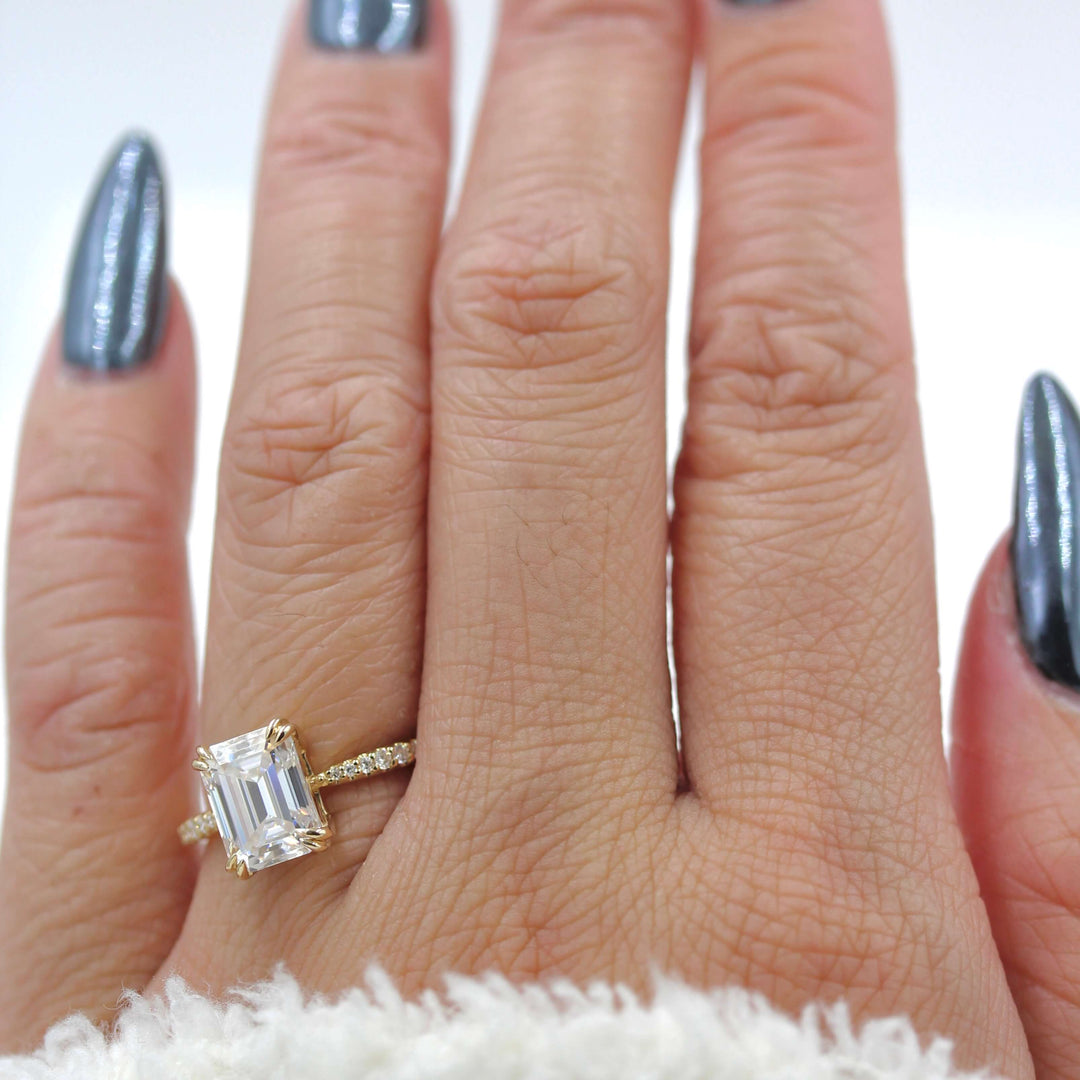 Hand modeling the Grace emerald cut engagement ring
