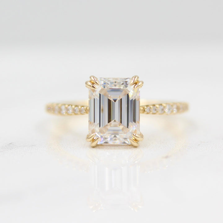 Grace emerald cut engagement ring with double claw prongs