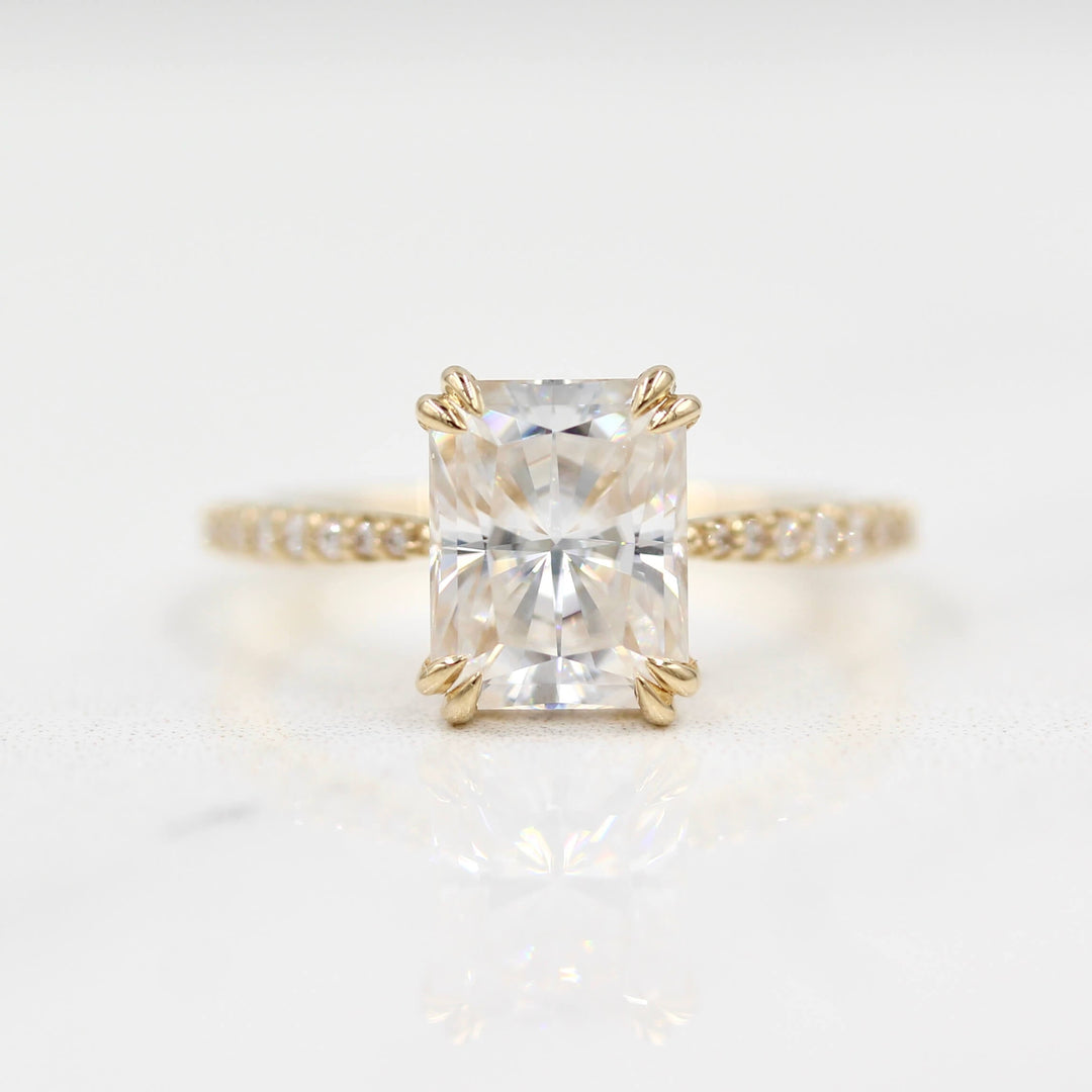 Radiant moissanite engagement ring with tapered diamond band