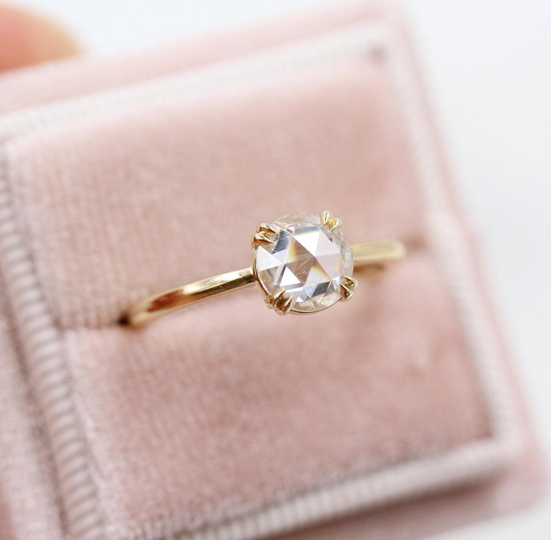 The Nora Ring (Round) in Yellow Gold in a pink velvet ring box