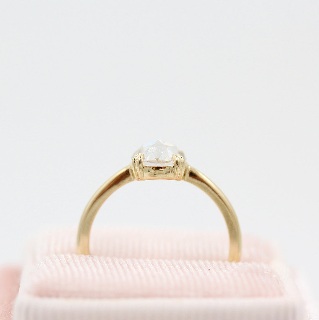 The Nora Ring (Round) in Yellow Gold in a pink velvet ring box