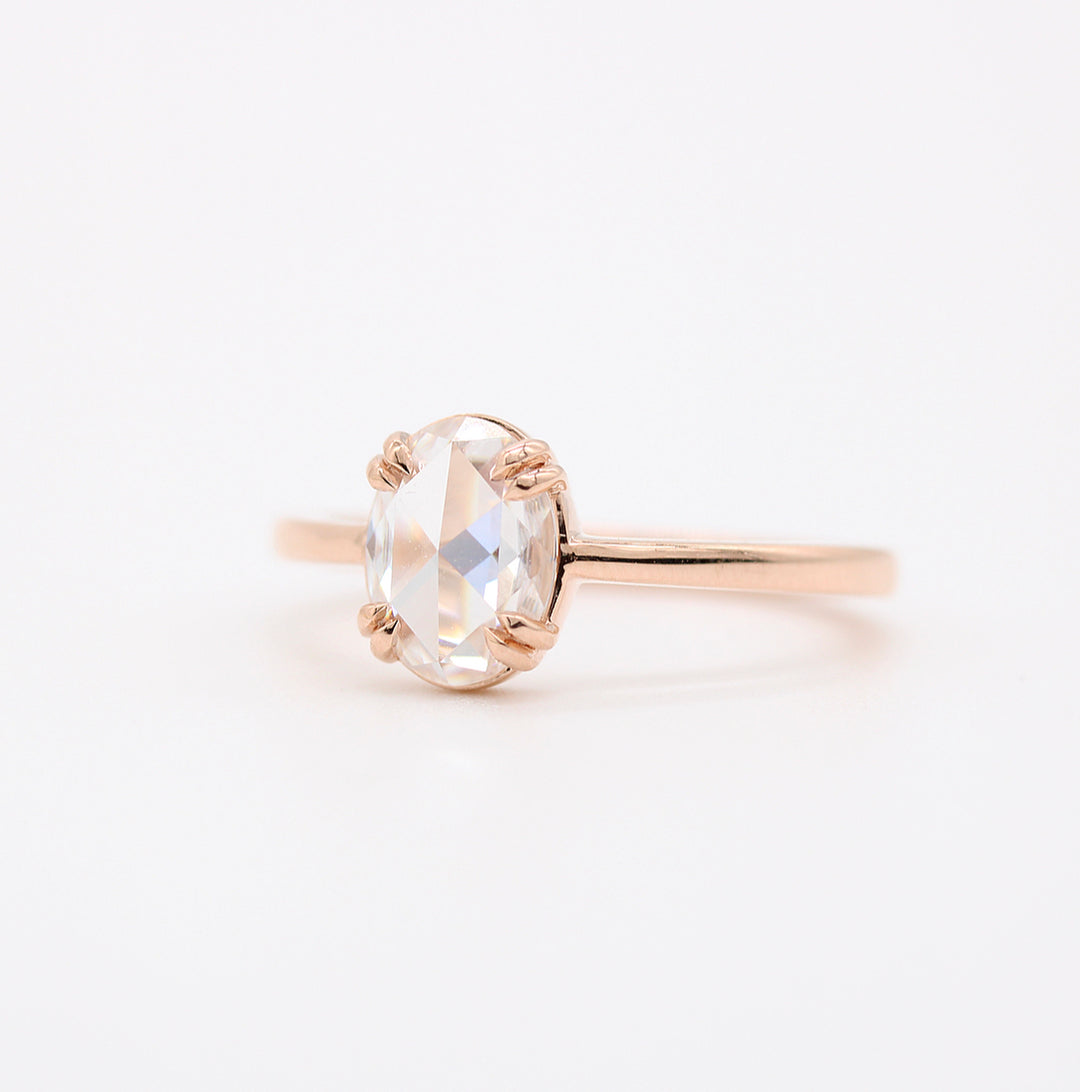 The Nora Ring (Oval) in rose gold against a white background