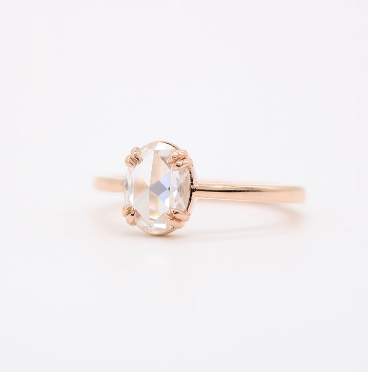 The Nora Ring (Oval) in rose gold against a white background