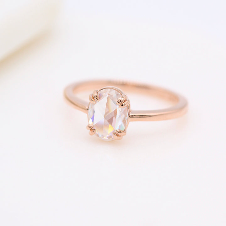 The Nora Ring (Oval) in rose gold against a white background