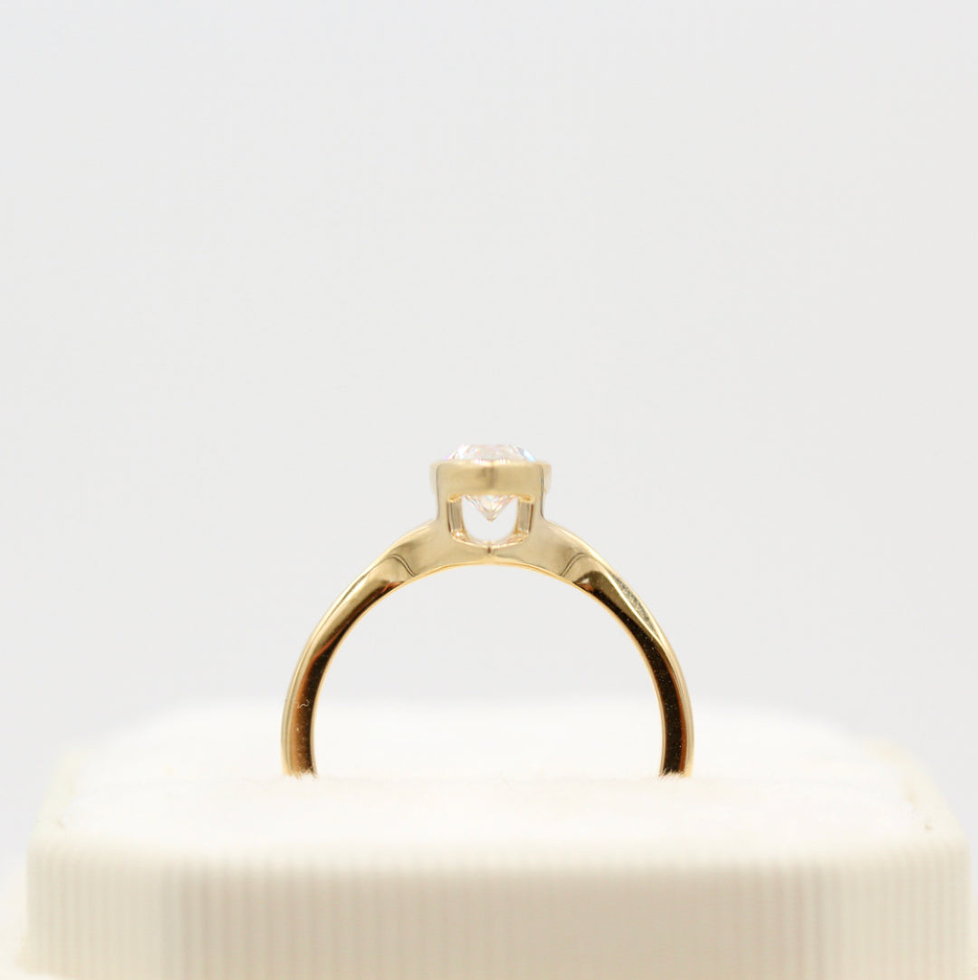 Profile of yellow gold bezel engagement ring