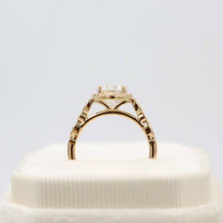 The Charlotte Ring (Oval) in Yellow Gold in a white velvet ring box