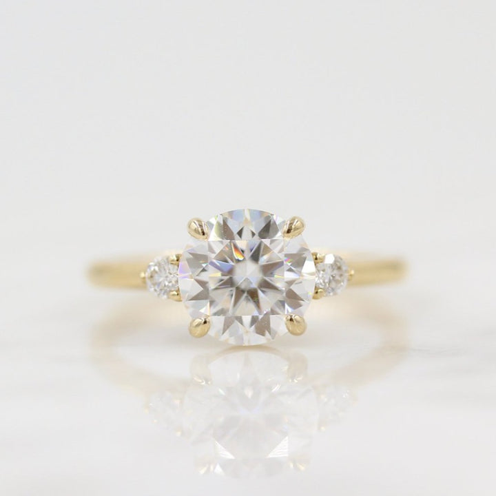 The Esme Ring (Round) in Yellow Gold with 2ct Moissanite against a white background