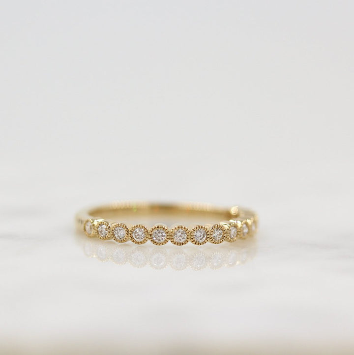 The Florence Wedding Band in Yellow Gold against a white background