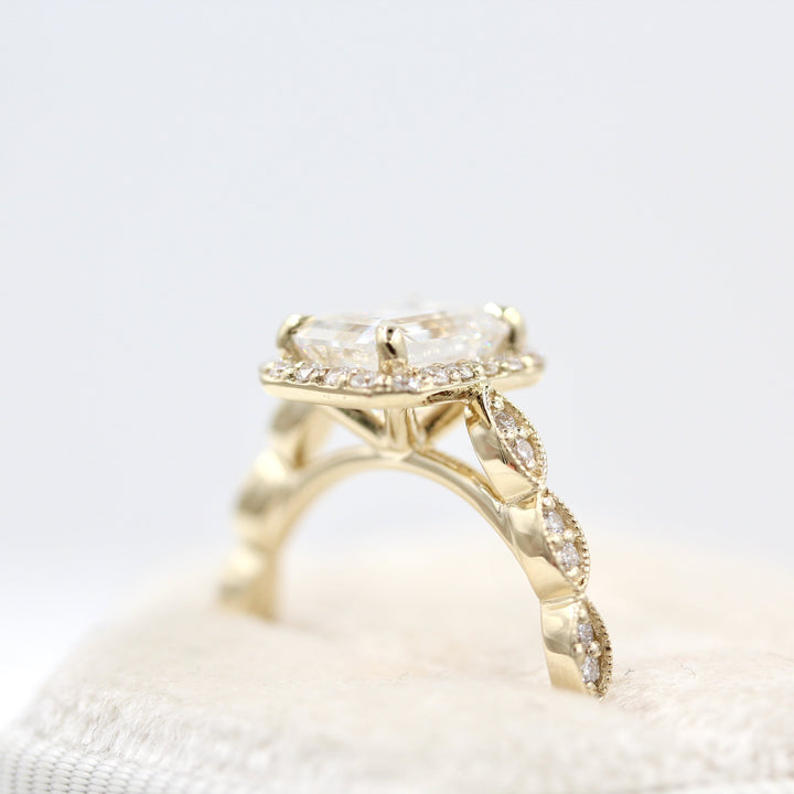 The Isla Ring (Emerald) in Yellow Gold and Moissanite in a white velvet ring box