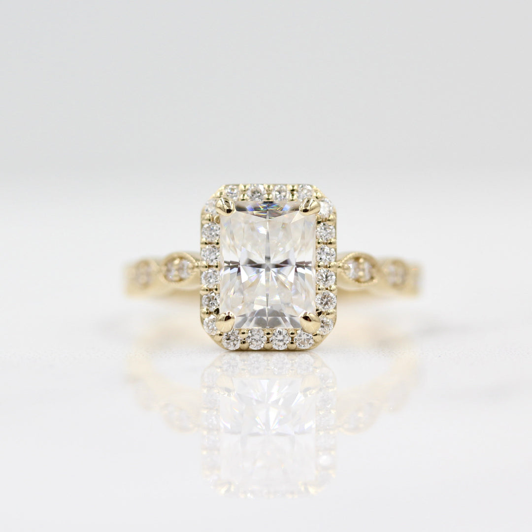 Radiant halo engagement ring with milgrain details