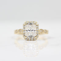 Radiant halo engagement ring with milgrain details
