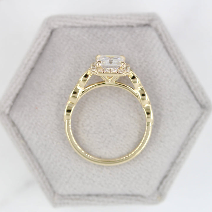 Side view of vintage-inspired radiant halo engagement ring