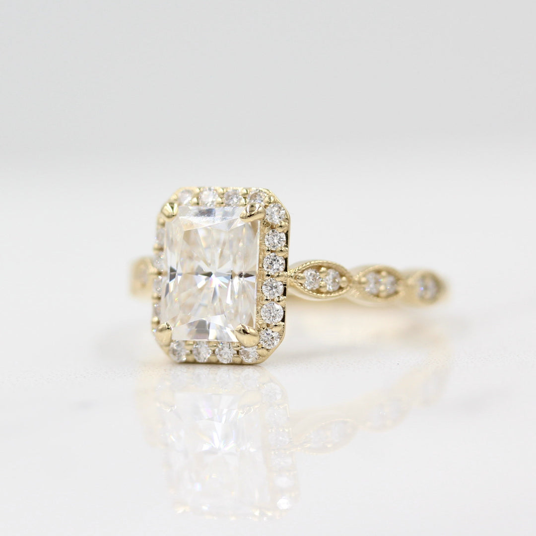 Slightly angled shot of vintage-inspired radiant halo engagement ring