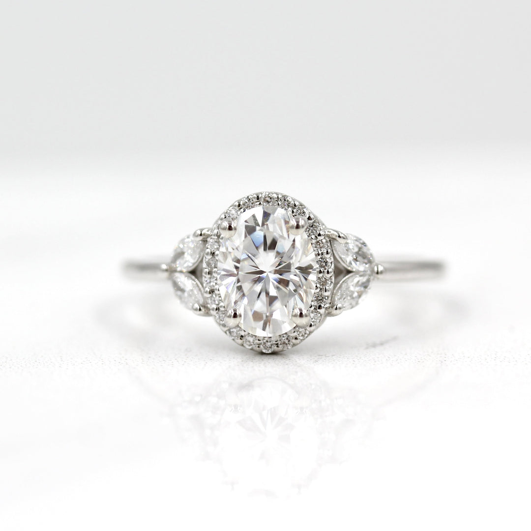 14k white gold oval halo engagement ring with nature-inspired details