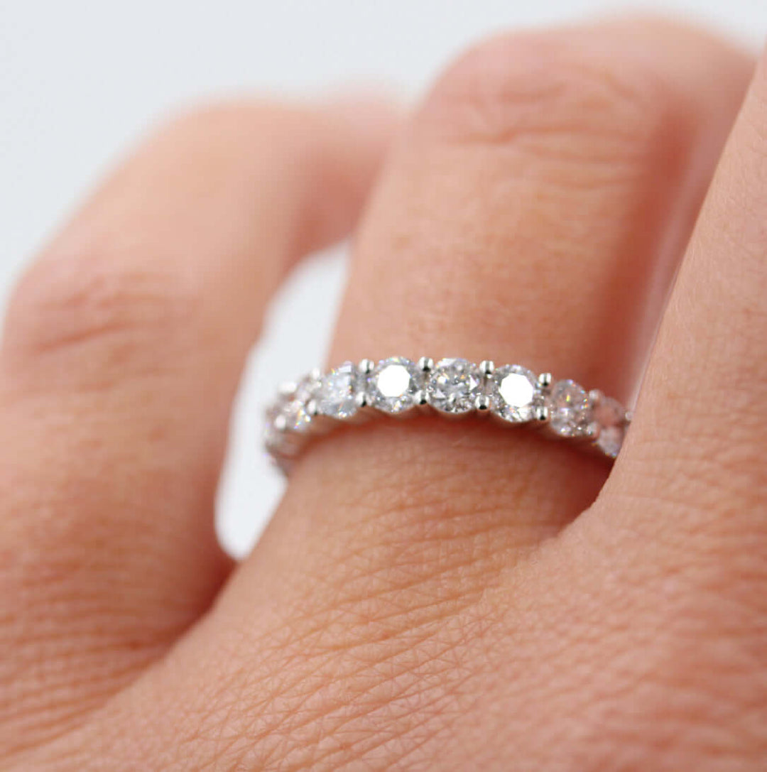 close-up of a hand wearing the 1-carat wedding band