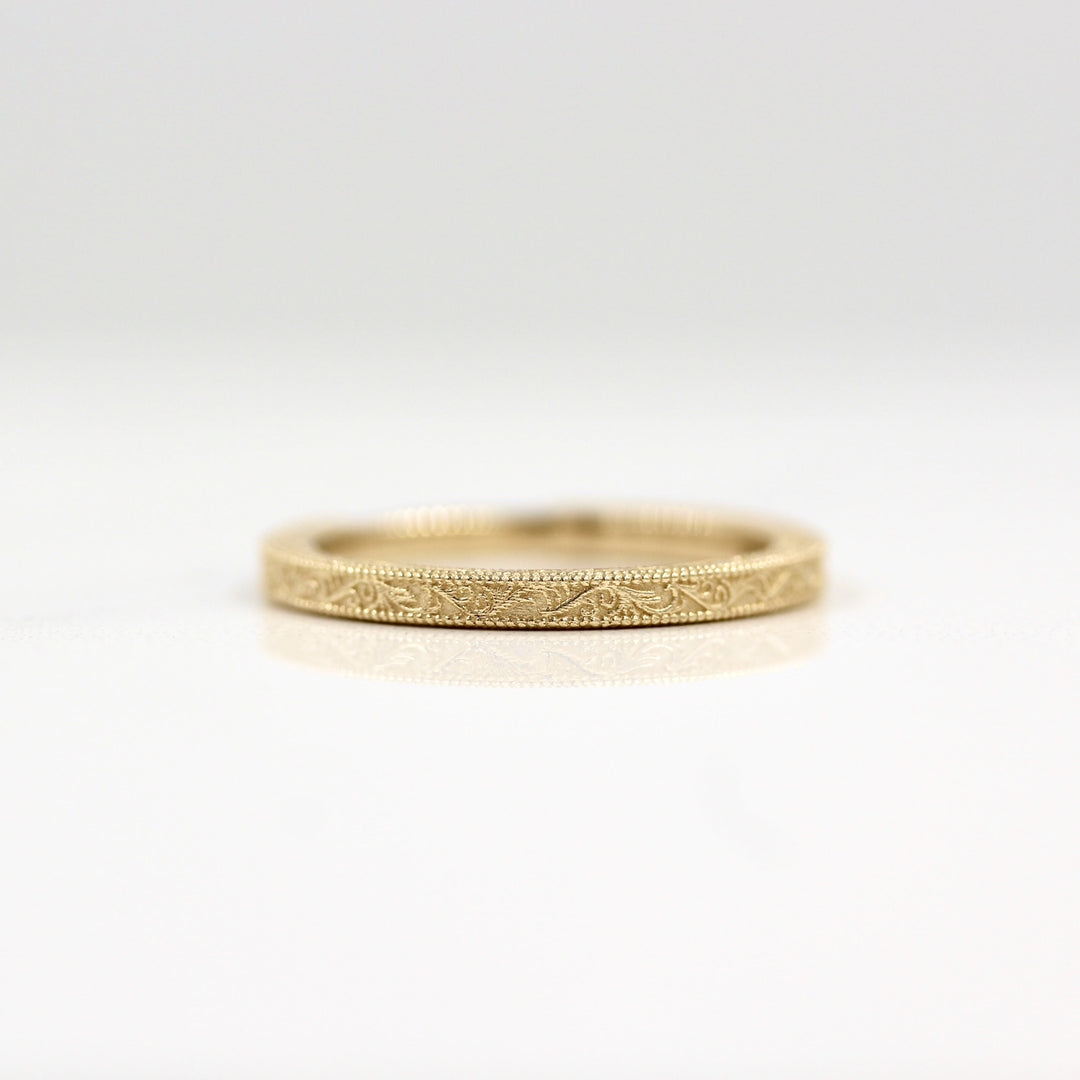 Engraved wedding band with milgrain details