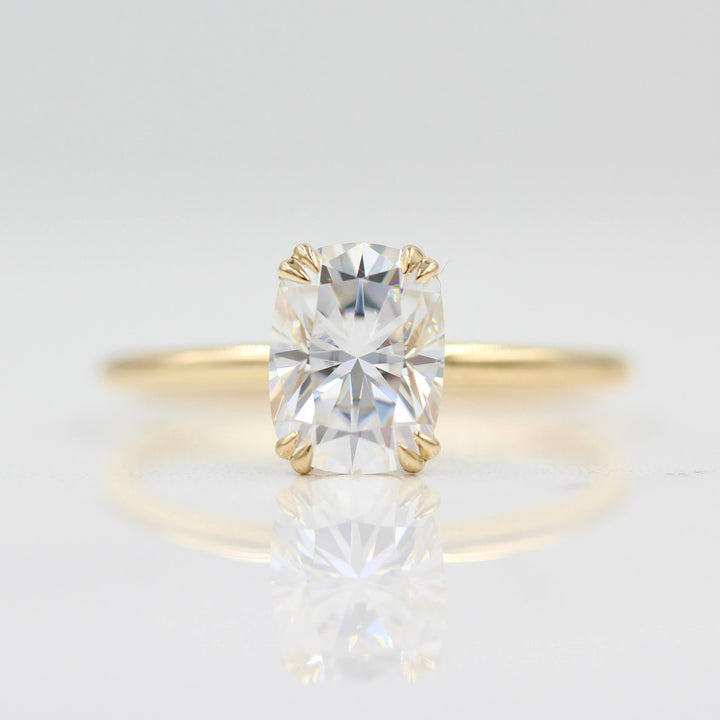 Double prong elongated cushion solitaire engagement ring