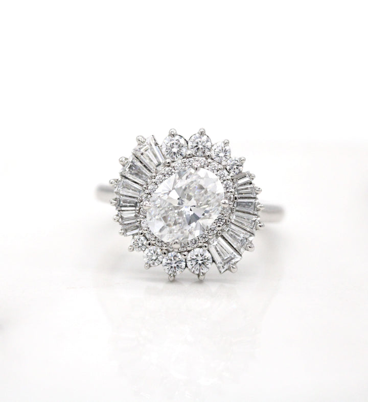 Unique engagement ring with a double halo and slanted oval center