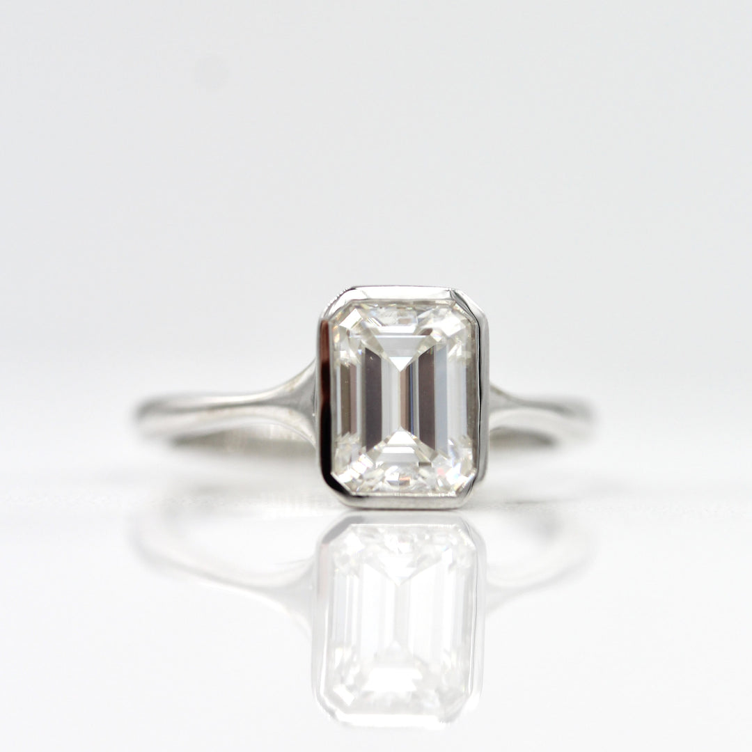 14k white gold bezel engagement ring with emerald cut lab-grown diamond