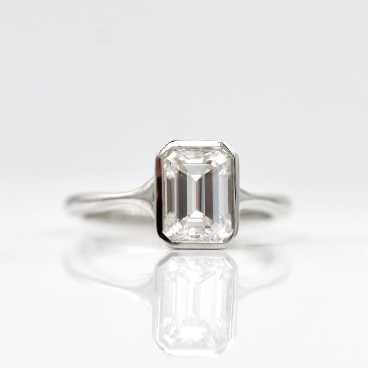 14k white gold bezel engagement ring with emerald cut lab-grown diamond