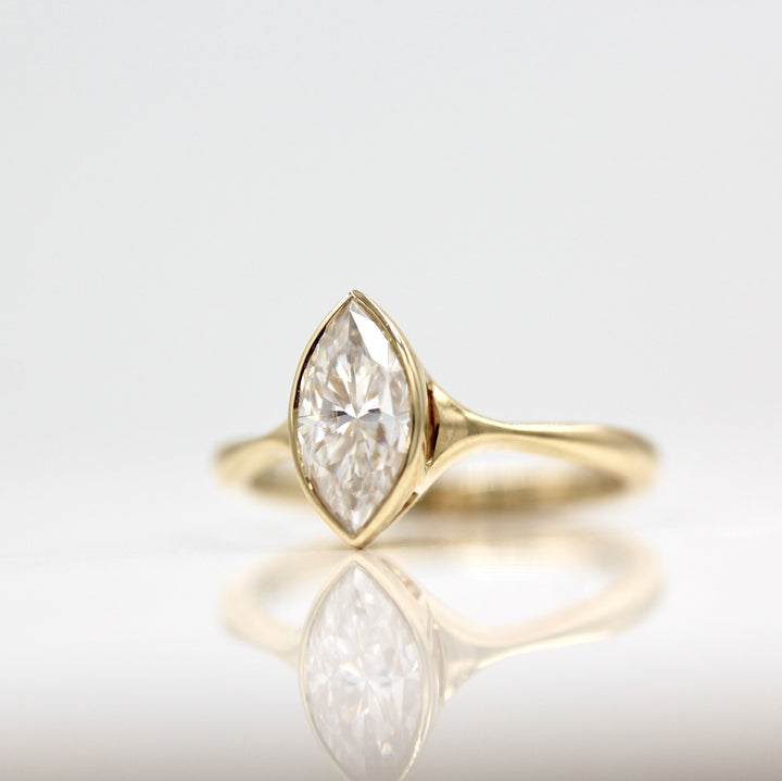 Bezel engagement ring with marquise lab-grown diamond