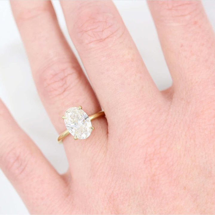 model wearing oval lab-grown diamond ring